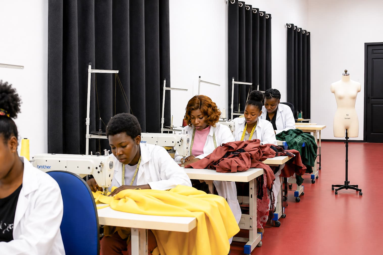 Student showcasing finished fashion design collection